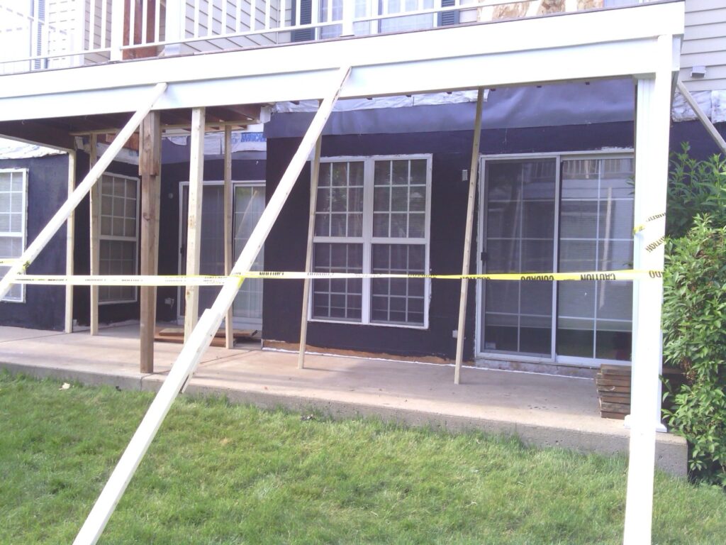 Exterior deck and balcony reconstruction at weather barrier stage