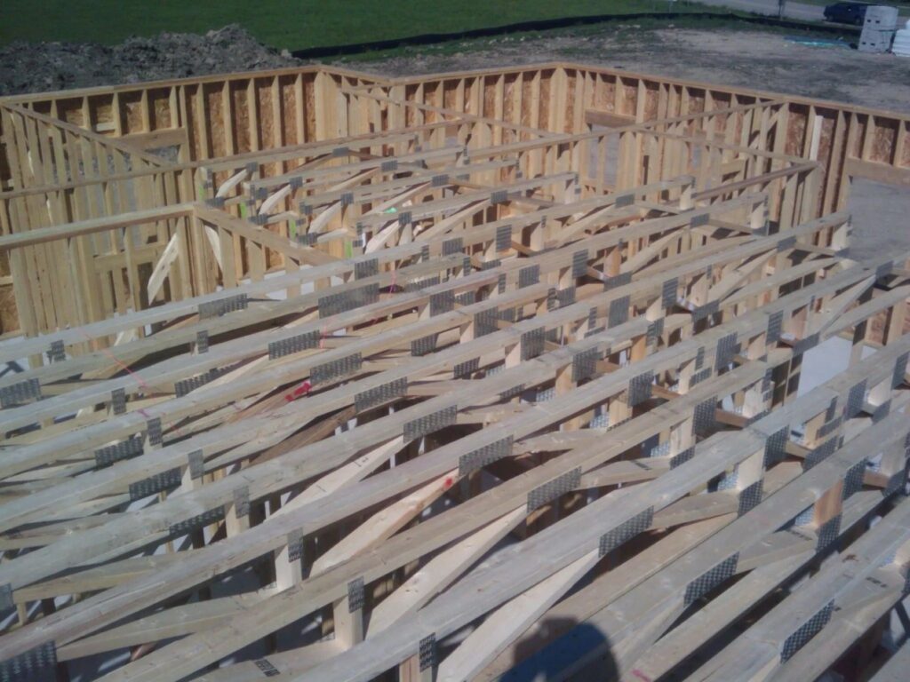 Engineered wood trusses set over a framed structure
